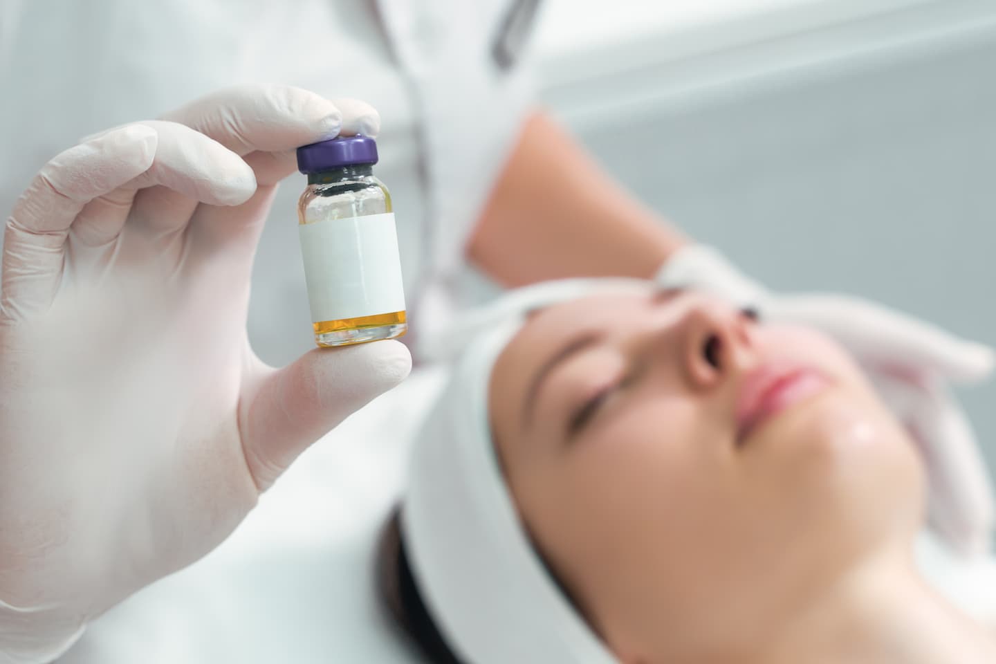 woman holds cosmetic product her hand solution injection 1