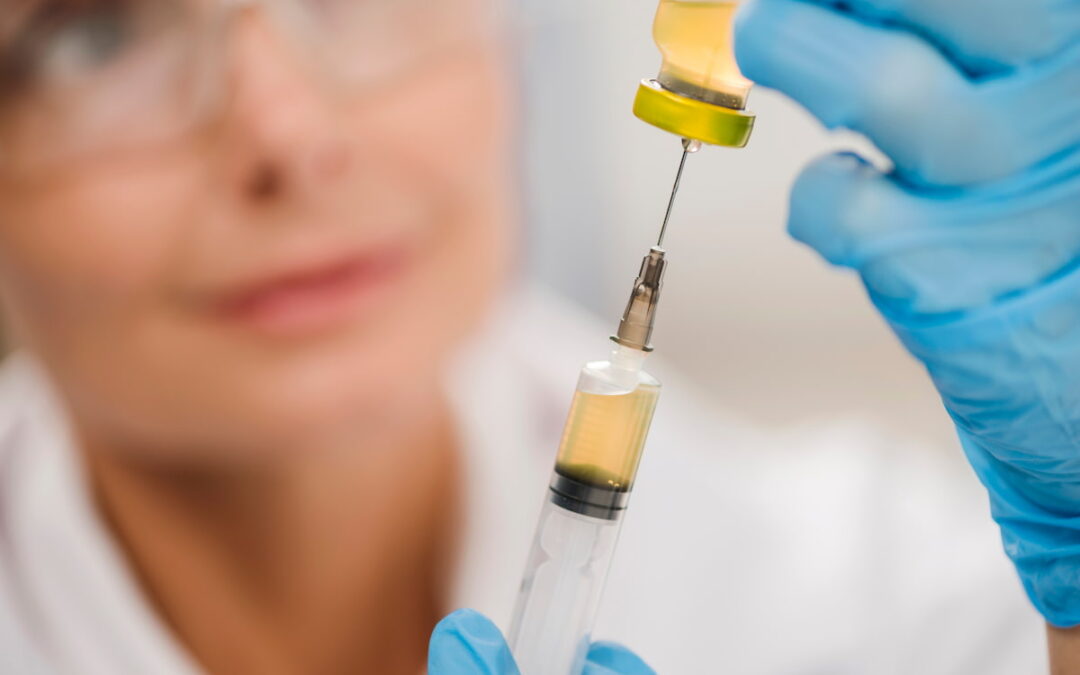 high-angle-defocused-female-scientist-using-syringe (1)